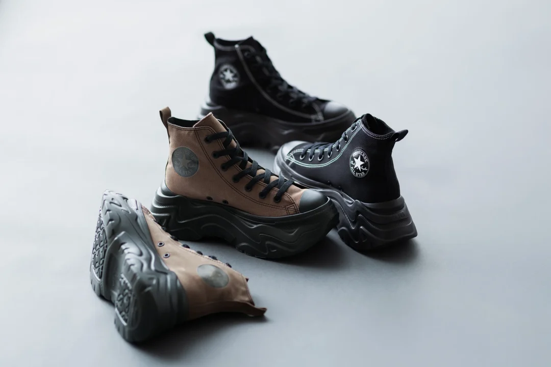Chunky Converse high-top shoe displayed in black and brown colorways, featuring oversized sculpted platform soles and rugged streetwear-inspired style