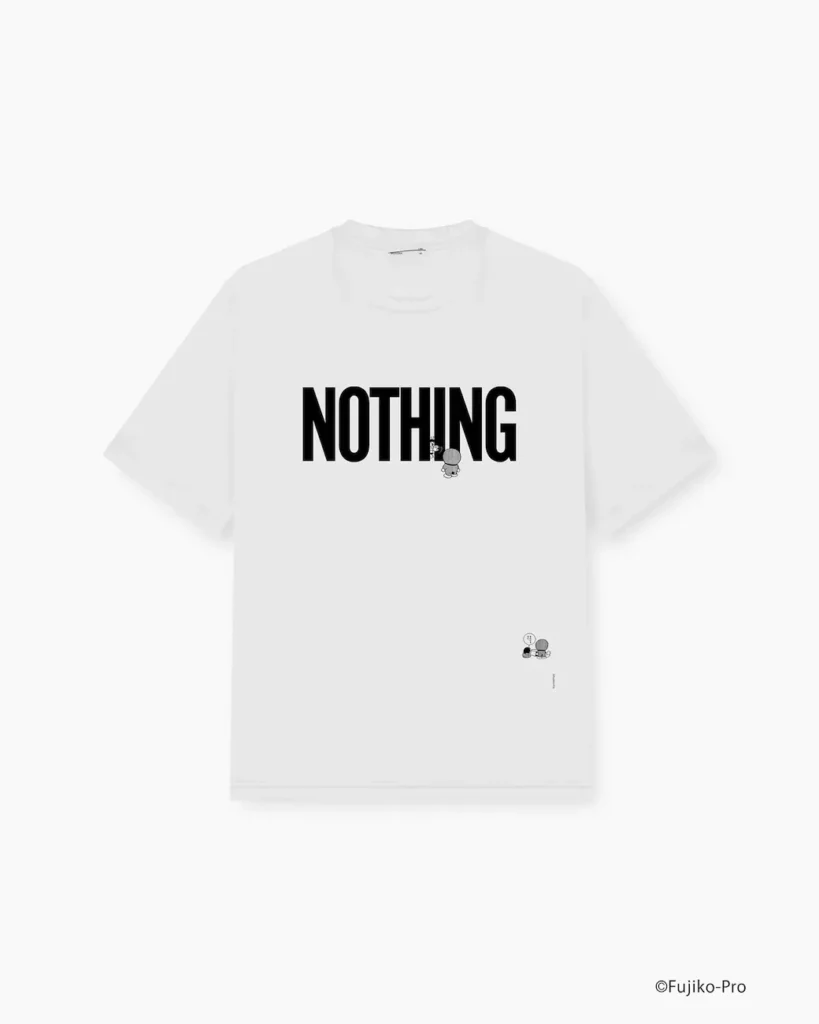 White short-sleeve T-shirt with a monochrome back graphic of Shizuka from Doraemon standing in profile and holding a gadget. Vertical “MUCH LOVE” typography and small technical-style text details add a contemporary streetwear show