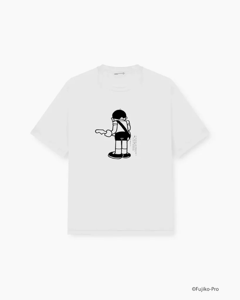 White short-sleeve graphic T-shirt displaying a black-and-white back print of Suneo from Doraemon seen from behind. Minimalist character artwork and small technical typography create a clean, collectible collision-style appearance