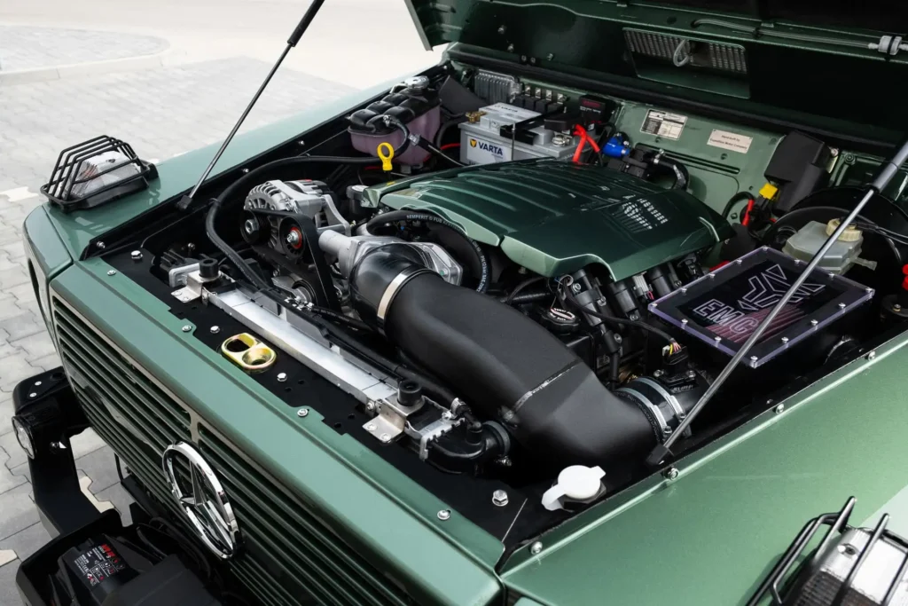 Engine bay of an Expedition Motor Company 620GE build displaying the upgraded LS3 V8 powertrain, custom intake system, and meticulously restored mechanical component