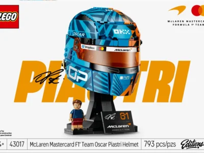 LEGO McLaren Formula 1 Team Oscar Piastri Helmet set box art featuring a detailed blue-and-orange brick-built racing helmet, display stand, signature plaque, and Oscar Piastri minifigure