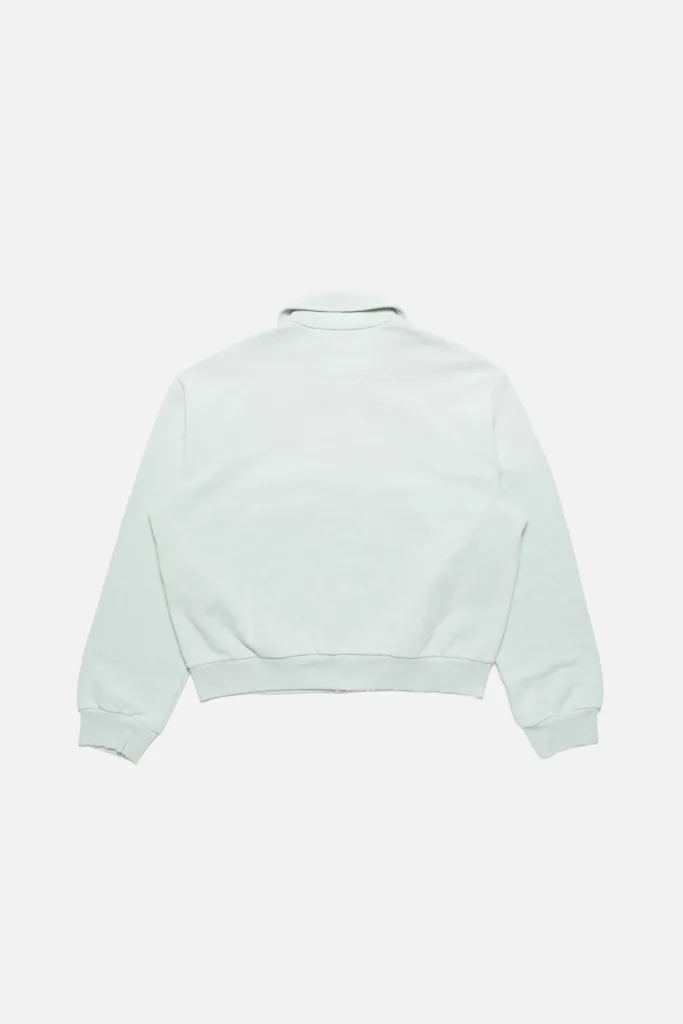 Rear flat-lay view of the Acne Studios mint green sweatshirt jacket highlighting the clean back panel, relaxed fit, dropped shoulders, and ribbed waistband and cuff