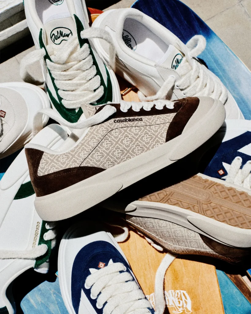 Group shot of multiple Casablanca Del Mar colorways—green, navy, and brown monogram—stacked among skateboard decks, showcasing the silhouette’s varied materials, oversized laces, and skate-culture-inspired presentatio