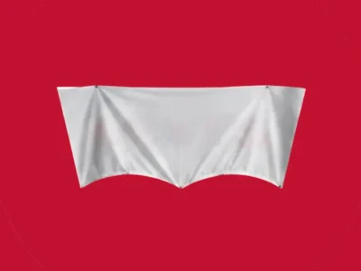 A minimalist promotional image features a white fabric sheet stretched taut across a horizontal frame, suspended against a vivid red background. The cloth is pinned at three points, creating sharp folds and a symmetrical drape that forms two curved valleys along the bottom edge. A faint circular outline surrounds the display, emphasizing the clean, graphic composition and giving the scene a gallery-like, conceptual presentation aesthetic