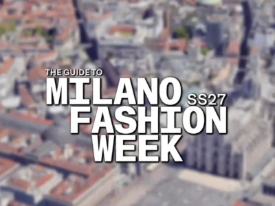 Promotional graphic for Milan Fashion Week Spring/Summer 2027 featuring a blurred aerial view of Milan’s historic city center. Large white typography reading “The Guide to Milano Fashion Week SS27” dominates the center of the image, creating a bold editorial-style visual that highlights one of fashion’s most important seasonal event