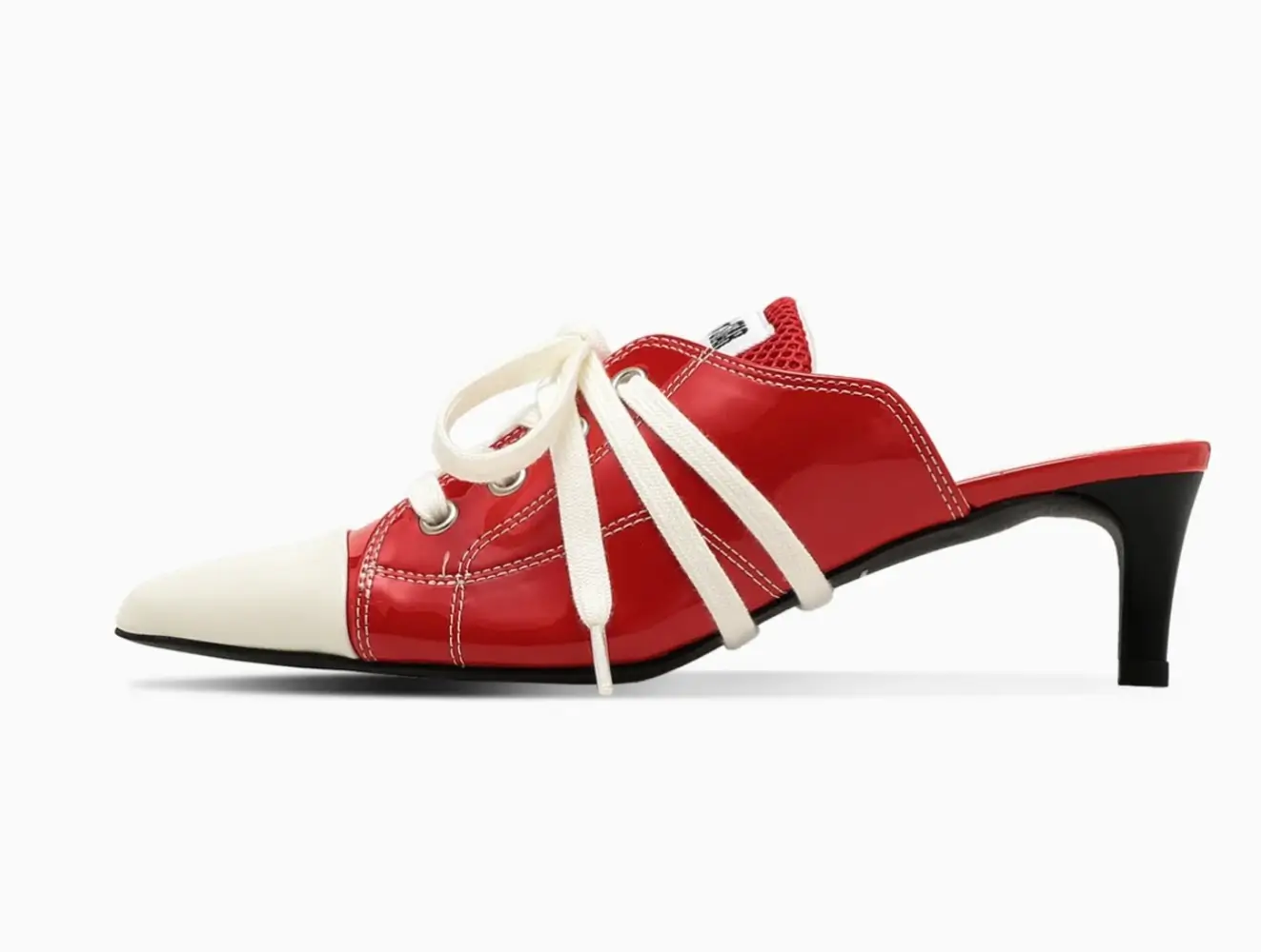 Side profile of a glossy red Converse-inspired mule heel featuring an off-white pointed toe cap, oversized cream laces, contrast stitching, and a sleek black kitten heel