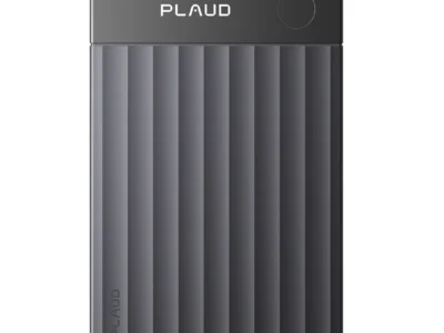 A dark gray PLAUD AI voice recorder featuring a ribbed textured finish, black top panel with a circular button, and clean industrial design on a white background