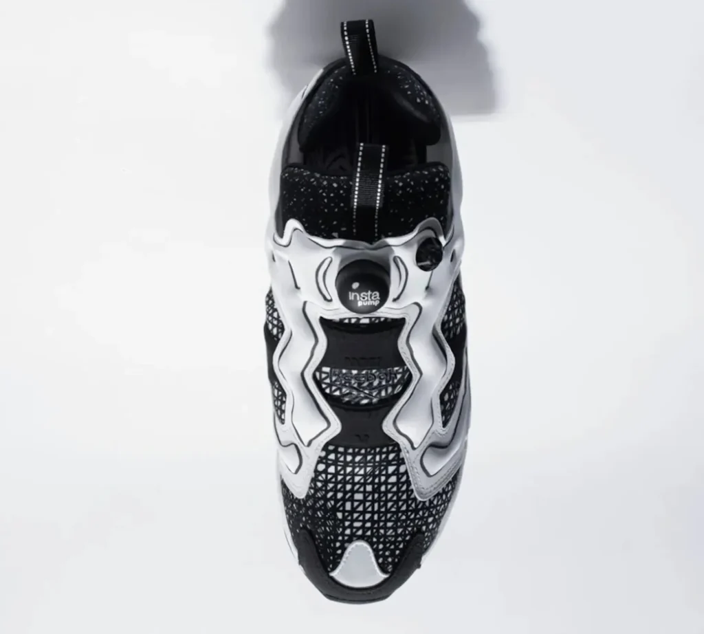 Top-down view of the Reebok Instapump Fury collaboration sneaker, showcasing the Pump closure system, patterned upper, and streamlined sil