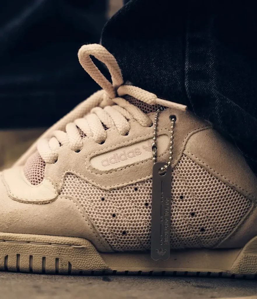 The off-white colorway is shown in action atop a skateboard, emphasizing its clean palette, cushioned build, and versatile style potential