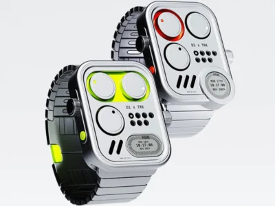 Two futuristic wristwatches with industrial-inspired designs are displayed against a light gray background. Each watch features a square silver case with rounded corners, circular analog-style time indicators, a small digital display, and bold accent lighting in neon green and orange-red. One model is paired with a dark segmented metal bracelet, while the other uses a silver-toned bracelet, emphasizing a blend of retro-futurism and modern wearable technology
