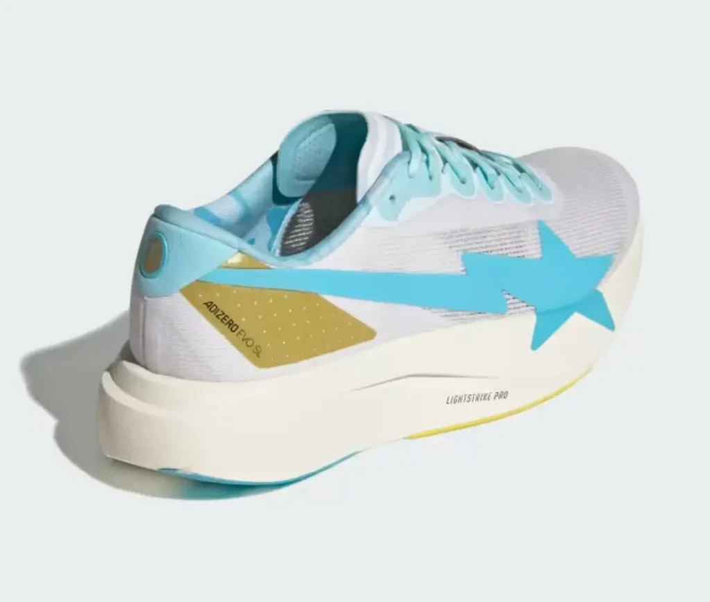 A rear-side view reveals the oversized blue star extending across the upper, metallic gold heel panel, Lightstrike Pro cushioning, and pastel blue camo-lined collar