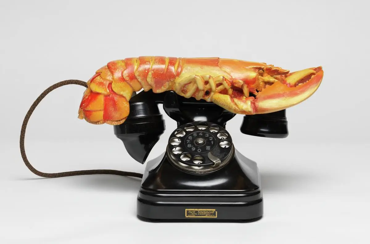 Vintage lobster telephone sculpture combining a realistic lobster with a black rotary phone, one of the most recognizable examples of Surrealist object design