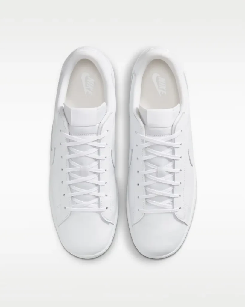 Top-down view of the Nike Tennis Classic CS displaying tonal white laces, padded collar, and understated Nike branding on the footbed