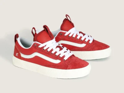 Side profile of the Vans Skate Old Skool 36+ x Evisen Skateboards shoe in bright red suede and leather with a white side stripe, textured white foxing, and green outsole accent