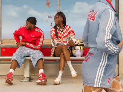 In a highly anticipated reunion after 24 years, Adidas Originals and Coca-Cola have joined forces once again to celebrate the FIFA World Cup 2026™. The collaboration revives their iconic 2002 partnership from the Japan-South Korea tournament, now reimagined for the biggest global sporting event of 2026, co-hosted by the United States, Canada, and Mexico. Set to launch on June 6, 2026, this collection masterfully blends Adidas' streetwear heritage with Coca-Cola's timeless branding, creating a vibrant fusion of football culture, nostalgia, and modern style. The drop arrives at a perfect moment. With the World Cup kicking off on June 11, 2026, fans worldwide are gearing up for a summer of football excitement. This collaboration isn't just merch—it's a cultural statement that merges two legendary brands under the banner of "Originals are the Real Thing," a clever twist on Coca-Cola's famous slogan. Historical Context: A Reunion 24 Years in the Making Adidas and Coca-Cola first collaborated during the 2002 FIFA World Cup, producing limited-edition pieces that captured the era's energy. That partnership helped define early 2000s football-streetwear crossover culture. Fast-forward to 2026, and the brands are back with fresh energy, leveraging Adidas' deep FIFA ties (as an official partner) and Coca-Cola's long-standing sponsorship of the tournament. The 2026 edition promises to be historic as the first 48-team World Cup, spanning three countries and generating unprecedented global hype. This collab taps into that momentum, offering fans wearable pieces that celebrate both brands' legacies while looking forward to the future of football fashion. Collection Overview and Design Philosophy The Adidas Originals x Coca-Cola collection fuses 2000s street style with classic sporting aesthetics. Expect bold reds, creams, whites, and silver accents inspired by Coca-Cola's iconic packaging—think classic script logos, droplet detailing, and can-inspired motifs. The lineup spans footwear, apparel, and accessories, divided into two visual directions: one logo-heavy and graphic-forward, the other drawing from vintage advertising aesthetics. Designs pay homage to Coca-Cola's visual language while staying true to Adidas Originals' archival roots. High-quality materials, attention to detail, and versatile silhouettes make these pieces suitable for both match-day wear and everyday street style. The campaign, featuring young football star Lamine Yamal and a diverse cast in everyday scenes building anticipation for the tournament, reinforces themes of originality and shared cultural moments. Footwear Highlights Footwear takes center stage in this collaboration, with reimagined takes on iconic 2000s Adidas silhouettes: Samba and Superstar Models: These classics get Coca-Cola treatment with white/cream/red colorways and prominent script branding. The Samba blends street heritage with football roots, while the Superstar II features weathered bases and bold side panels. Expected pricing around $110–$130. Adistar Control 5: A standout with droplet detailing mimicking condensation on a cold Coke can. This model brings performance-inspired design into lifestyle territory. Predator Sala: Indoor/hybrid style with silver-and-red accents, nodding to predatory precision on the pitch and Coca-Cola's bold energy. Climacool 1: Revived with breathable tech and Coke-inspired graphics, perfect for warm summer days. Megaride F50: A highlight paying tribute to the iconic Coca-Cola glass bottle, with unique contours and refreshing design cues. Each pair incorporates thoughtful details like embroidered logos, custom insoles, and packaging that mimics vintage Coke crates or cans. These shoes are built for durability and comfort, appealing to sneakerheads, football fans, and casual wearers alike. Apparel and Accessories Beyond kicks, the collection offers a full lifestyle range: Track Tops and Jerseys: Standout jerseys fuse retro Coca-Cola advertising from different eras into cohesive football designs. Track jackets feature signature three stripes alongside Coke branding, in vibrant reds and classic whites. Shorts and T-Shirts: Relaxed fits with graphic prints, ideal for casual wear or layering. Expect motivational football motifs blended with refreshing beverage references. Accessories: A bright red airliner bag stands out as a functional statement piece. Additional items may include caps, socks, and tote bags carrying the collaborative spirit. The apparel emphasizes comfort with premium cotton blends, mesh panels for breathability, and oversized silhouettes popular in contemporary streetwear. Unisex sizing and inclusive fits make the collection accessible to a broad audience. Cultural Impact and Fan Appeal This collaboration resonates on multiple levels. For football fans, it represents national pride and global unity ahead of the 2026 tournament. Sneaker enthusiasts will appreciate the nostalgic 2000s revival mixed with modern execution. Streetwear collectors see it as a prime example of how heritage brands can innovate through partnerships. In an era where sports and fashion increasingly intersect, Adidas and Coca-Cola deliver pieces that transcend the pitch. Wear them to watch matches at home, attend watch parties, or hit the streets in any host city—New York, Los Angeles, Toronto, or beyond. The designs are versatile enough for gym sessions, festivals, or daily commutes. The timing aligns perfectly with rising interest in football in North America, boosted by the co-hosting nations. Young talents like Lamine Yamal in the campaign help bridge generational gaps, attracting newer fans while satisfying longtime supporters. Where to Buy and Release Details The collection launches globally on June 6, 2026, via: Adidas CONFIRMED app (for early access and raffles) Adidas.com Select retailers and flagship stores worldwide Some regions may see staggered drops, with Japan and other markets getting early access. Prices are expected to range from $50–$150 depending on the item, making it relatively accessible compared to ultra-limited drops. Pro Tips for Copping: Enable notifications on the CONFIRMED app. Check local stock at Adidas stores in major cities. Monitor resale platforms post-drop for exclusive colorways, but be wary of markups. Size up slightly for oversized apparel fits. Given the World Cup hype, popular items like the Sambas and jerseys are likely to sell out quickly. International shipping is available, but factor in potential customs delays. Styling Suggestions Match Day Look: Pair a collaborative jersey with classic black shorts and Samba sneakers for effortless fan style. Streetwear Rotation: Layer a track top over a graphic tee with wide-leg pants and the Megaride F50 for a bold urban ensemble. Casual Summer: White Superstar with denim shorts and the airliner bag for a refreshing, vacation-ready vibe. These pieces mix seamlessly with existing Adidas or neutral wardrobes, maximizing versatility. Broader Context in 2026 Fashion and Sports The Adidas x Coca-Cola drop is part of a larger wave of high-profile collaborations tied to the World Cup. Adidas continues its dominance in football kit design, while Coca-Cola leverages its sponsorship with collectibles, bottles, and experiential activations like the Trophy Tour. In the sneaker industry, this collab exemplifies the ongoing trend of lifestyle reinterpretations of performance silhouettes. It also highlights how global brands use major events to drive cultural conversations around unity, originality, and joy—core values for both companies. Sustainability notes (based on Adidas' broader initiatives) suggest some pieces may incorporate recycled materials, aligning with modern consumer expectations. Looking Forward: Legacy and Excitement As the countdown to kickoff continues, this collection serves as the perfect prelude to an unforgettable summer of football. Whether you're a die-hard supporter, a fashion-forward collector, or someone seeking motivation through style, the Adidas Originals x Coca-Cola FIFA World Cup 2026 lineup delivers. Expect potential restocks, special event exclusives in host cities, and continued campaign content featuring more athletes. This isn't just clothing—it's a ticket to participate in the global celebration of the beautiful game. Mark your calendars for June 6, 2026. Refresh your wardrobe, lace up those Sambas, and get ready to cheer on your team in style. The "Real Thing" meets the Originals in what promises to be one of the most talked-about releases of the year. This collaboration captures the essence of football's universal appeal: bringing people together through shared passion, iconic brands, and unforgettable moments. As the world prepares for 2026's expanded tournament, Adidas and Coca-Cola remind us that some partnerships are truly timeless.