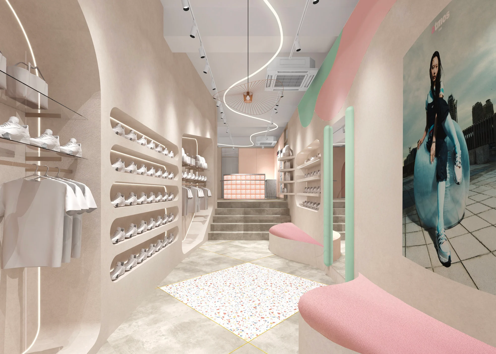 Narrow view inside the atmos Pink store showcasing rounded wall shelving lined with white sneakers, soft beige walls, pastel pink and mint architectural accents, sculptural seating, flowing ceiling light installation, apparel displays, and a large fashion campaign image creating a modern, lifestyle-focused shopping space