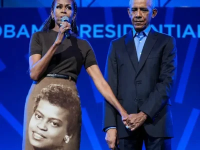 Michelle Obama and Barack Obama at the Obama Presidential Center. Michelle wears custom Acne Studios skirt with portrait of her late mother Marian Robinson, June 2026