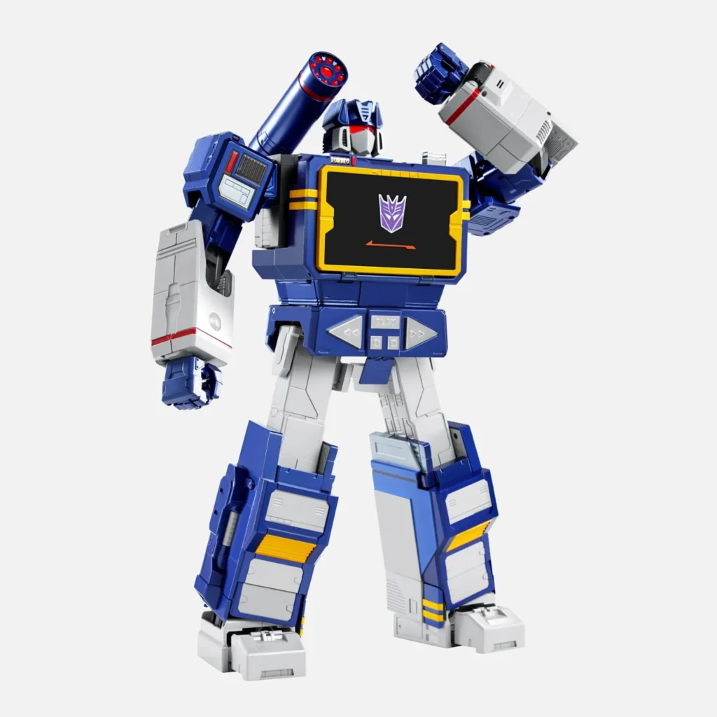 Three-quarter view of the Soundwave Collector’s Edition robot posed with one arm raised, showcasing its articulated limbs, shoulder cannon, cassette-inspired chest, and classic blue-and-silver color scheme