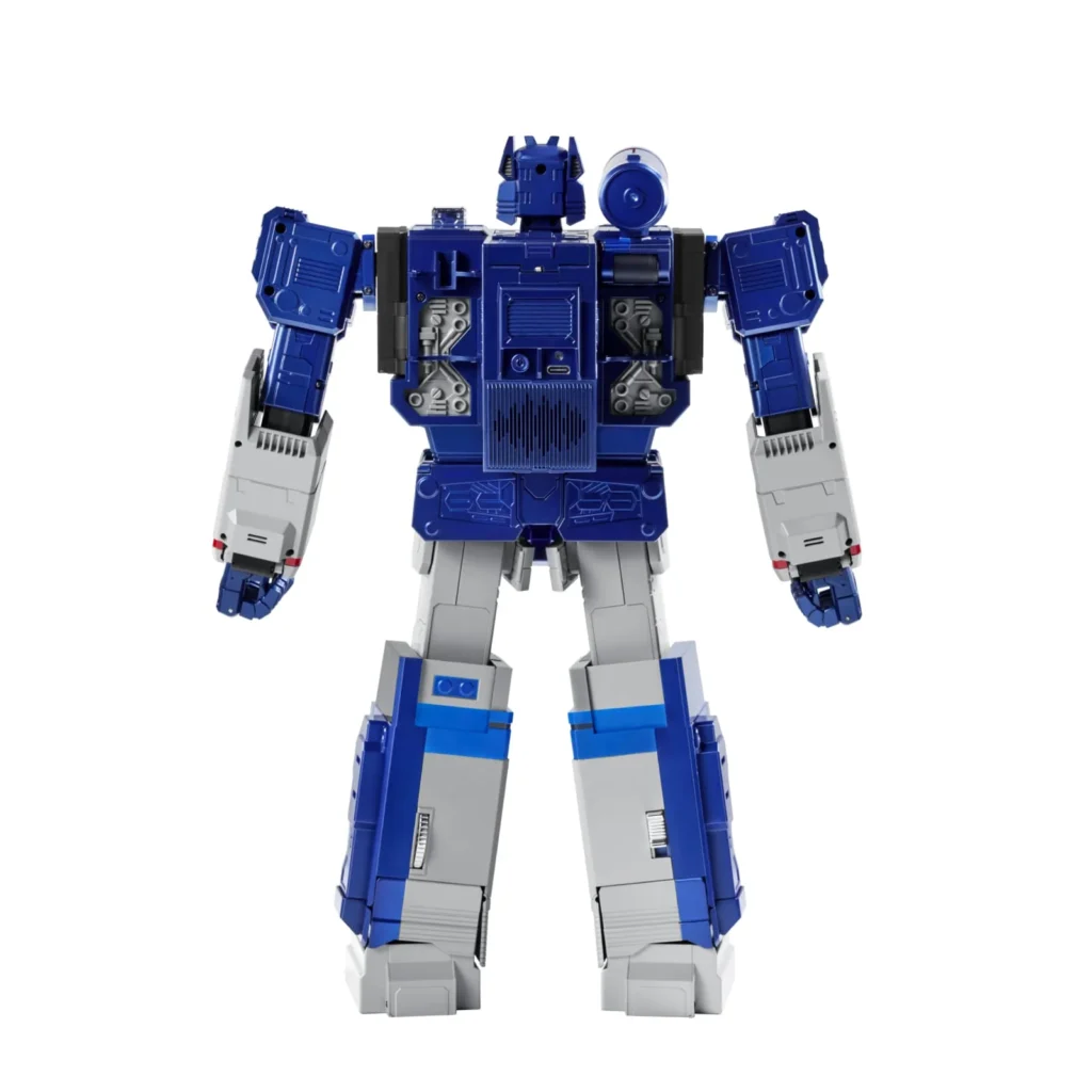 Rear view of the Soundwave robot revealing intricate mechanical sculpting, speaker-style panel details, articulated joints, and the mounted shoulder cannon from behind