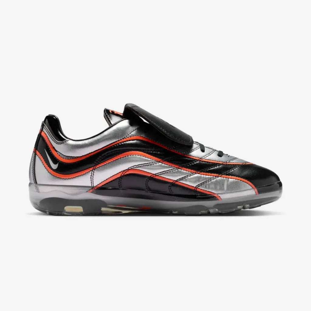 Opposite side profile highlighting the flowing black patent overlays, metallic silver leather panels, orange-red trim, miniature heel Swoosh, and futuristic Cryoshot sole construction