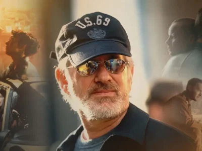 A cinematic collage centers on a bearded filmmaker wearing a navy cap embroidered with “U.S.69” and mirrored sunglasses, illuminated by warm golden light. Surrounding him are softly blended scenes featuring dramatic character interactions, a truck cab moment, intimate profile portraits, and a wartime-style gathering, creating a visual retrospective of storytelling and filmmaking. The composition uses rich amber tones, shallow depth of field, and layered imagery to evoke the atmosphere of a celebrated director’s body of work