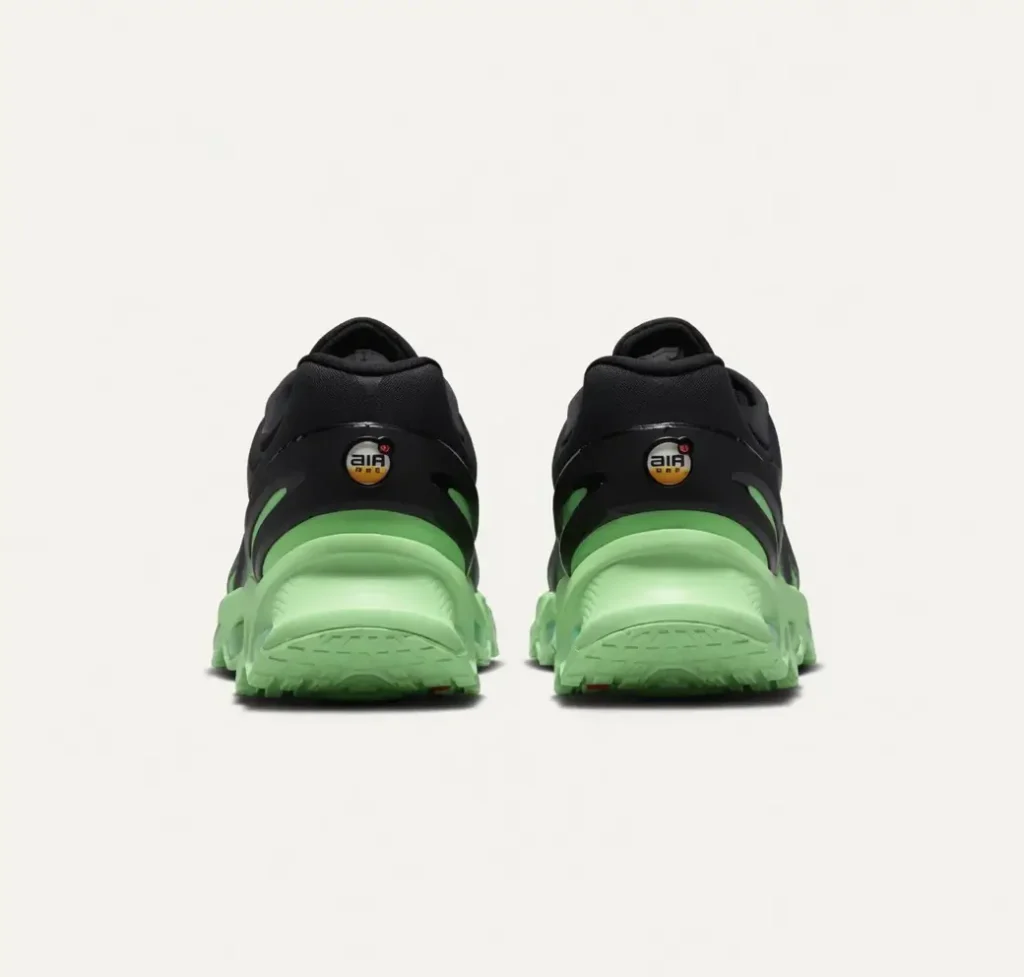 Rear view of the Nike Air Max Dn8 highlighting the sculpted heel structure, Air Max heel branding, and oversized lime-green cushioning platform. The design combines view flow