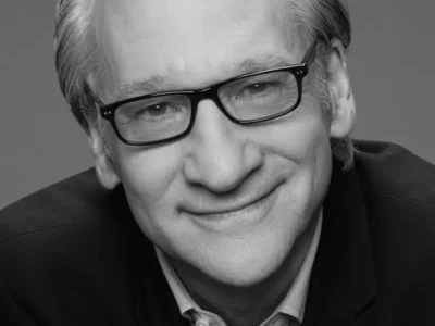 Bill Maher in striking monochrome portrait. The sharp black-and-white tones highlight his signature wit and thoughtful expression, capturing the veteran comedian and political commentator in a classic, timeless style