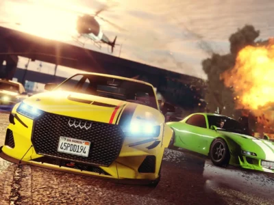 Action-packed racing scene featuring customized sports cars speeding through a city street as a massive explosion erupts in the background. A bright yellow performance sedan dominates the foreground with illuminated headlights and aggressive bodywork, while a green tuner car and a police vehicle follow behind. A helicopter hovers overhead against a dramatic sunset sky, creating a cinematic atmosphere filled with speed, chaos, and high-stakes pursuit