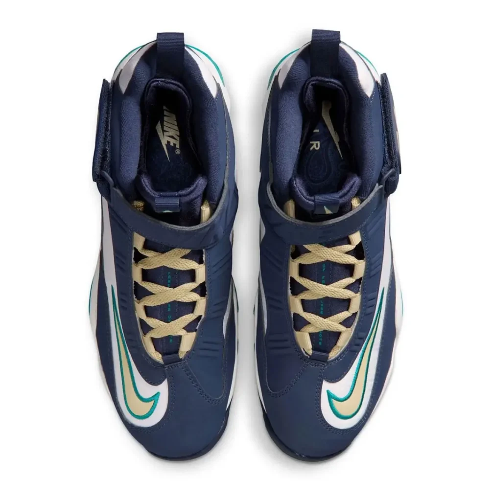 Top-down view of the Nike Air Griffey Max 1 “HBCU Swingman Classic,” highlighting navy uppers, cream-colored laces, padded collars, embroidered Swooshes, and the adjustable midfoot strap design