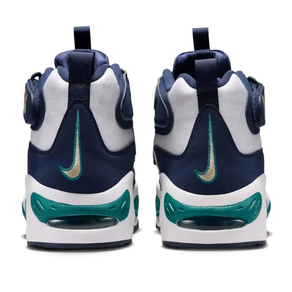 Rear view of the Nike Air Griffey Max 1 “HBCU Swingman Classic,” showcasing embroidered heel Swooshes, navy and white color blocking, teal Air unit detailing, and pull tabs at the heel