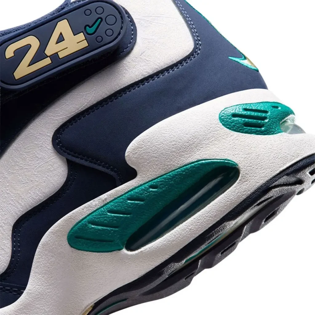 Detailed macro shot of the Nike Air Griffey Max 1 midsole, revealing teal Air unit windows, textured white foam construction, navy overlays, and premium material finishes inspired by the Swingman Classic theme