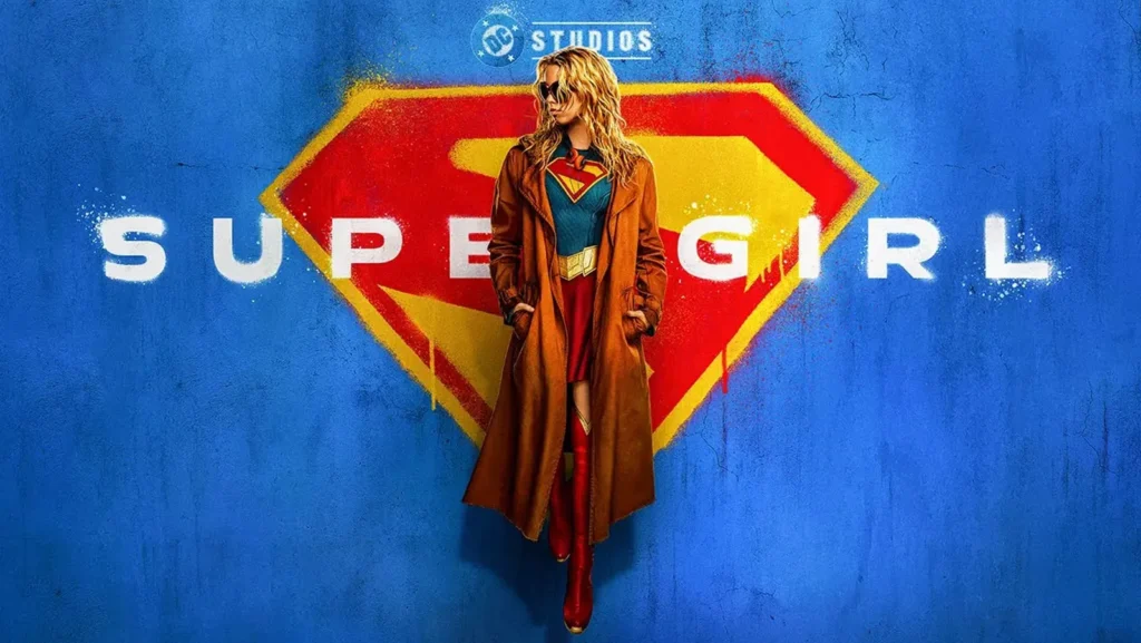 Milly Alcock channels rebellious cool as Supergirl in the official 2026 poster. Trench coat over the iconic suit against a graffiti S-shield — James Gunn’s Woman of Tomorrow lands June 26. Pure attitude