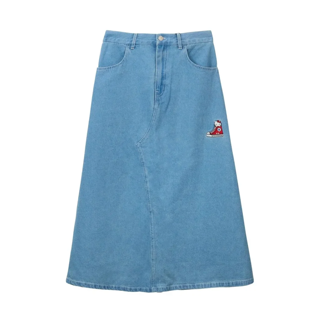 Light-wash denim midi skirt from the Hello Kitty x Converse collection featuring a small embroidered Hello Kitty and shoe patch near the hip