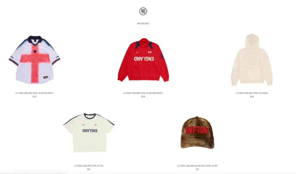 England-themed Cactus Jack x Nike Total 90 apparel capsule featuring a white football jersey with a large red St. George’s Cross graphic, red anthem jacket, cream hoodie, off-white T-shirt with inverted “ENGLAND” text, and a distressed brown cap with red embroidered letter