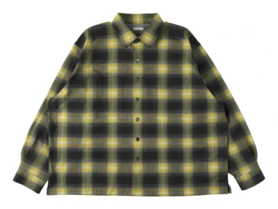 Oversized olive and charcoal plaid button-up overshirt featuring a soft brushed fabric, classic pointed collar, full front button closure, two oversized chest patch pockets, dropped shoulders, and a relaxed boxy sil