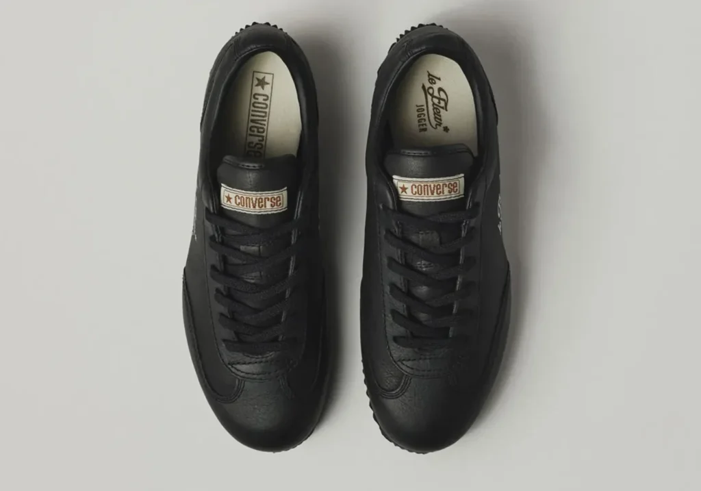 Overhead view of the black leather Converse le FLEUR* Jogger with black laces, vintage Converse tongue label, and co-branded insole