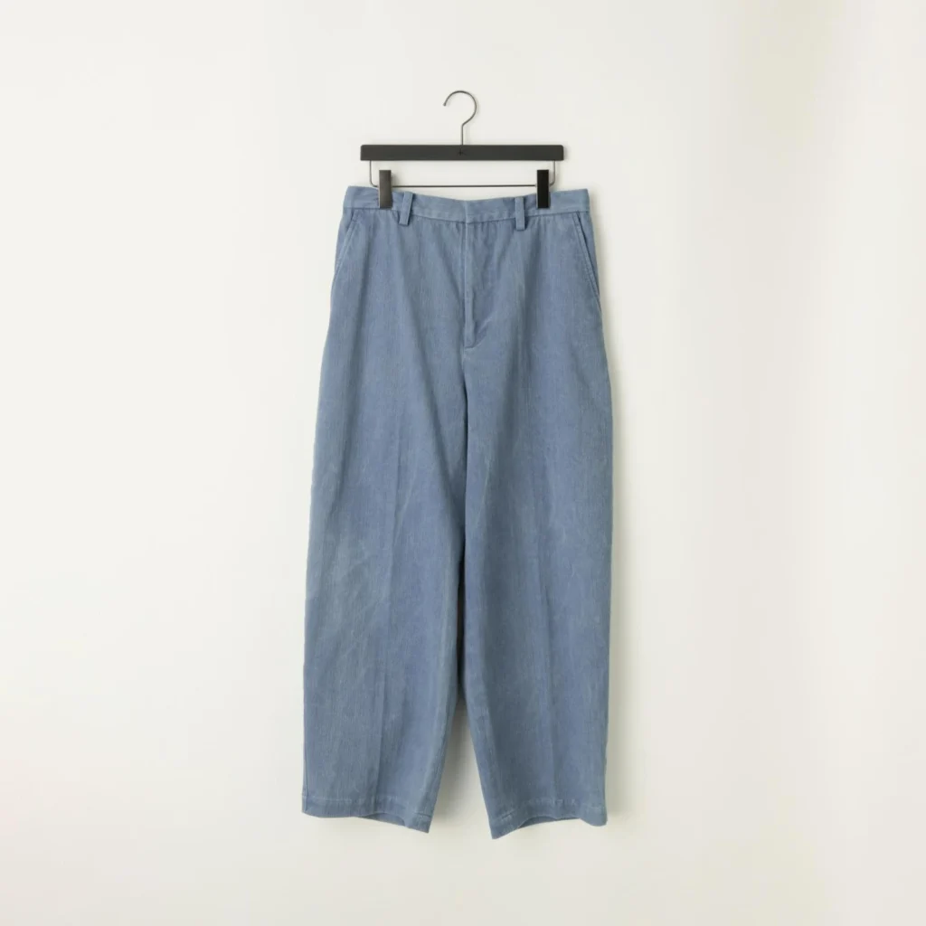 Light blue wide-leg denim trousers with a high-rise waist, clean front construction, belt loops, side pockets, relaxed oversized sil, and cropped straight-leg finish