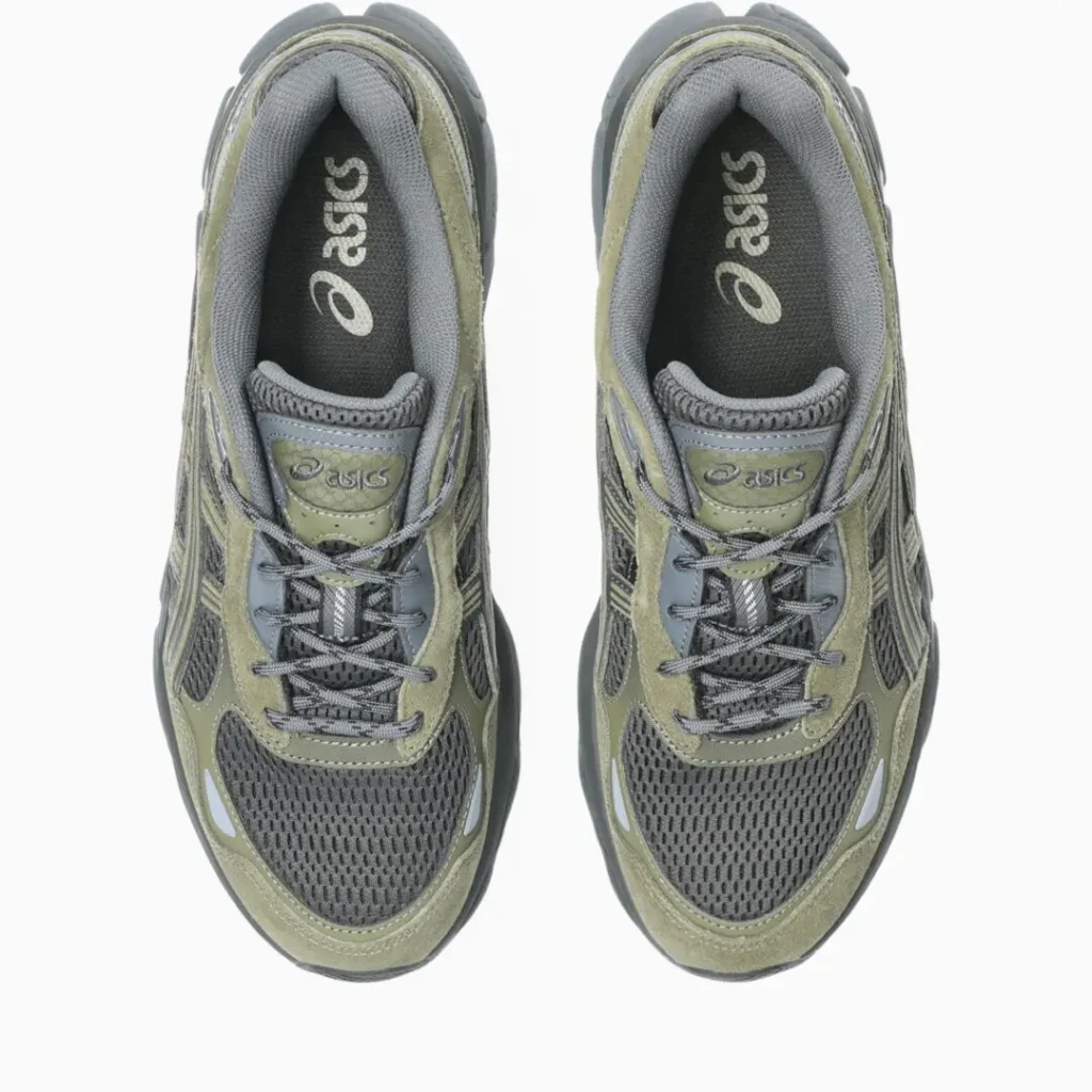 Top view of a pair of olive green and dark gray ASICS GEL-NYC shoes, showing the mesh toe boxes, gray laces, padded collars, branded tongues, and ASICS insole