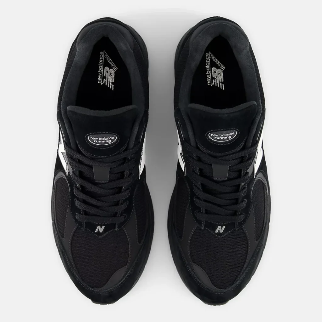 Top-down view of the New Balance 2002R GORE-TEX pair, showcasing black mesh toe boxes, padded collars, suede tongues with New Balance Running branding, tonal rope laces, and cushioned interior