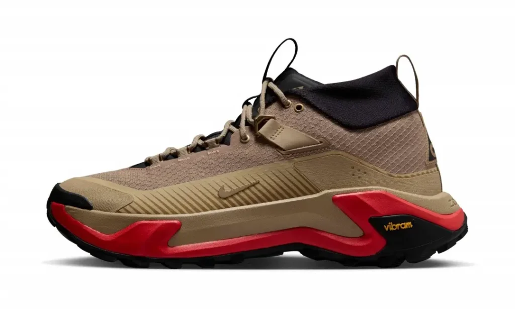 Lateral profile of the Nike ACG Zegama Hike in a khaki, black, and red colorway featuring a ripstop-style upper, ZoomX midsole, and Vibram outsole