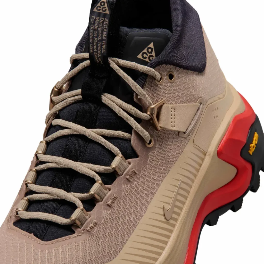Close-up of the Nike ACG Zegama Hike focusing on the technical lacing system, textured mesh upper, molded support wing, and tonal Swoosh