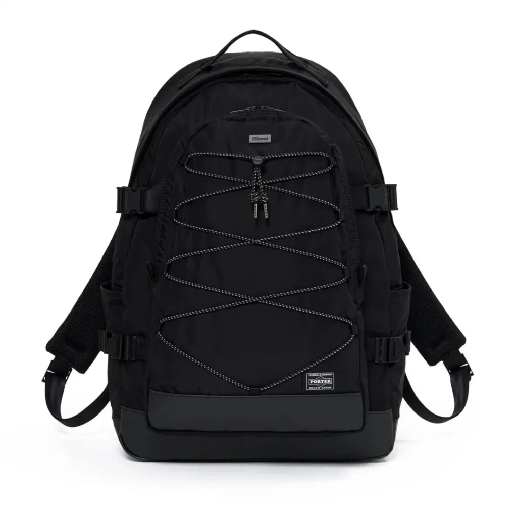 A black PORTER backpack with reflective front bungee cord lacing, spacious zip compartments, side mesh pockets, compression straps, padded shoulder straps, and reinforced bottom panel is displayed against a white background