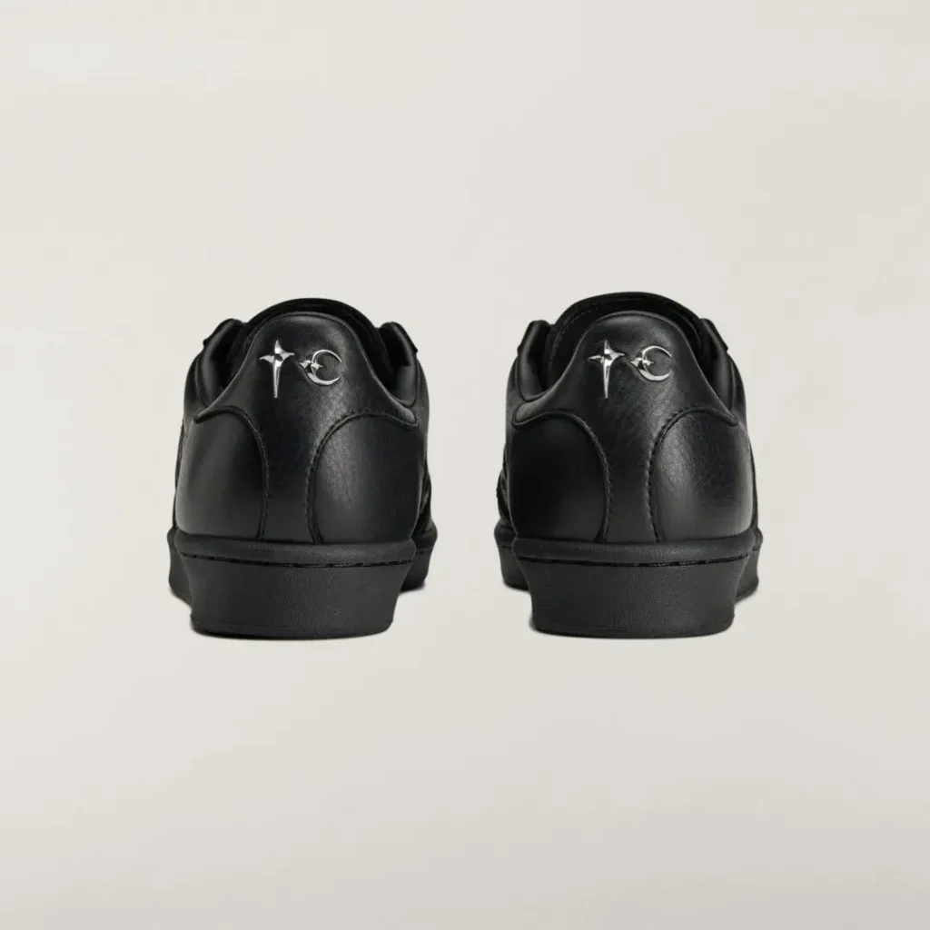 Rear view of the adidas Originals by Taqwa Bint Ali Superstar with tonal heel embroidery and black rubber sole