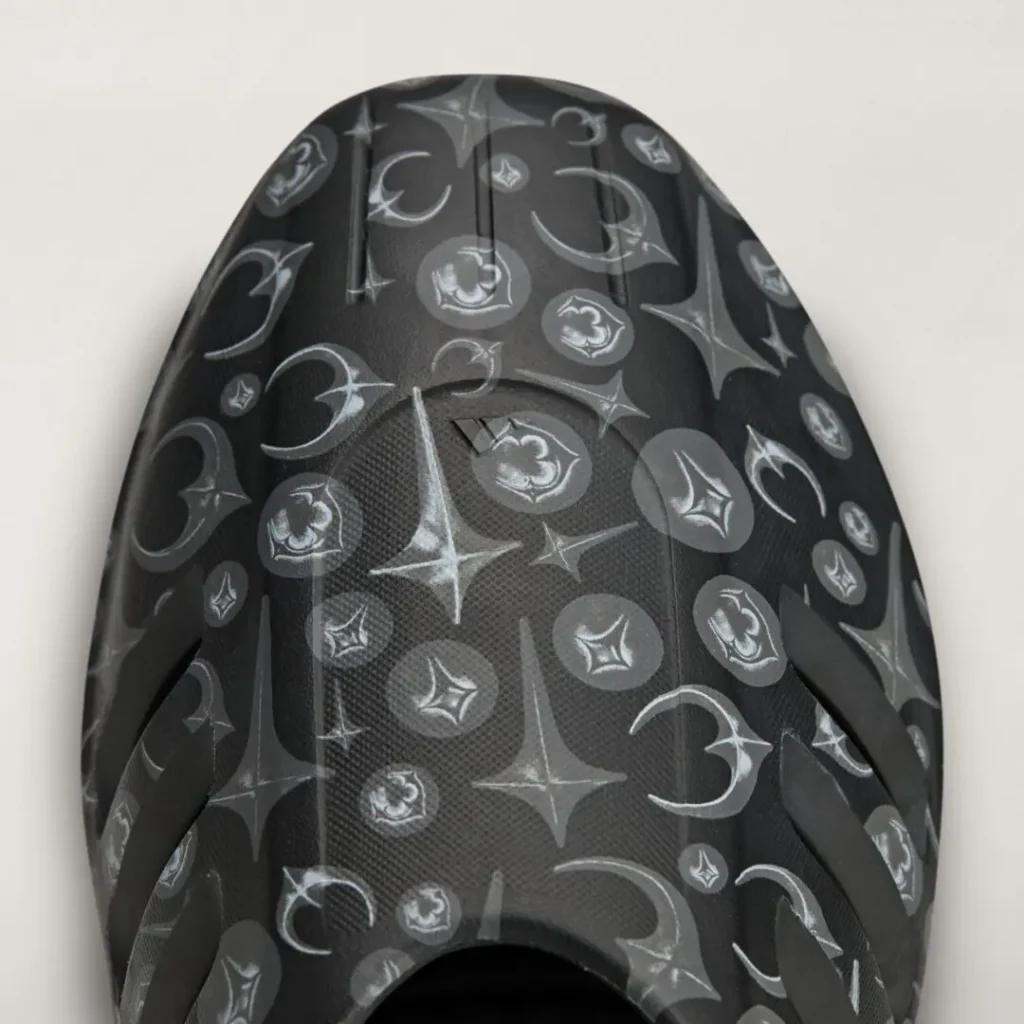 Close-up of the adidas Originals by Taqwa Bint Ali Adistar Cushion Mule featuring the collection's monochrome graphic pattern