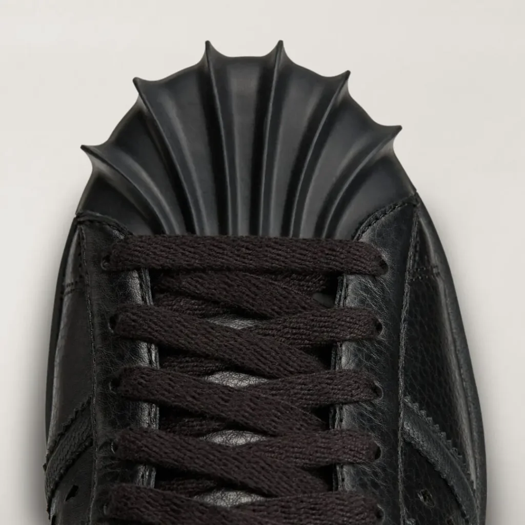 Close-up of the adidas Originals by Taqwa Bint Ali Superstar's exaggerated sculptural shell toe with black leather and tonal lace