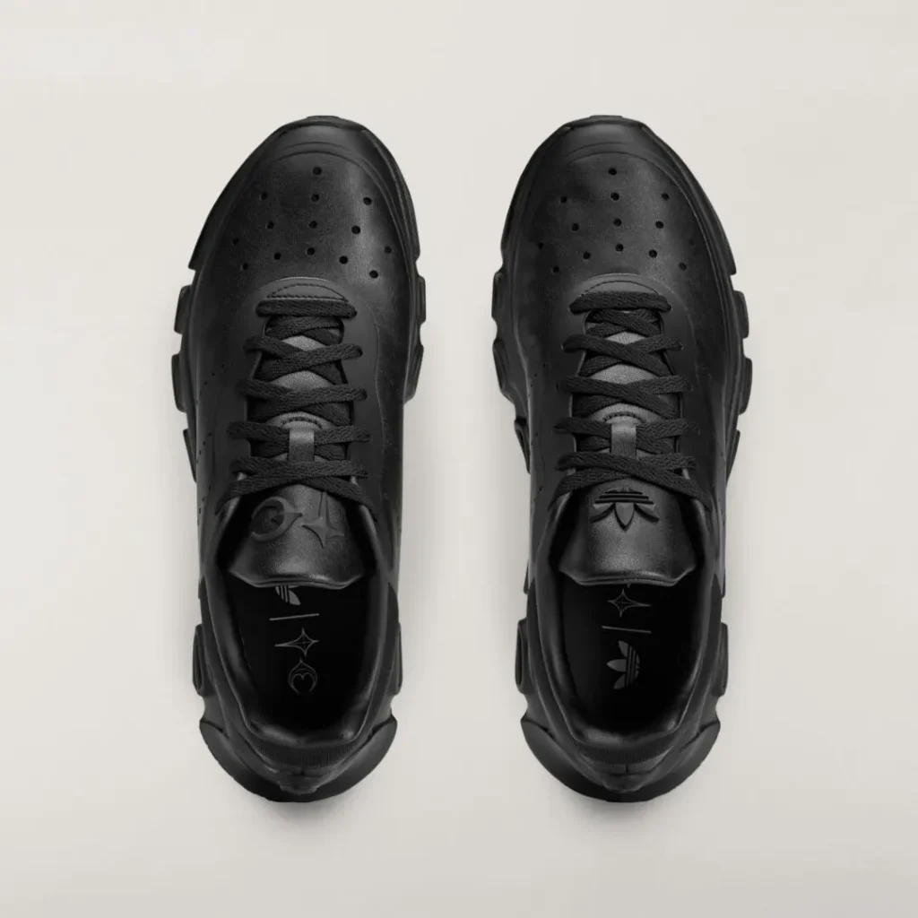 Top view of the black adidas Originals by Taqwa Bint Ali Megaride S2 with tonal leather upper, co-branded insoles, and black lace