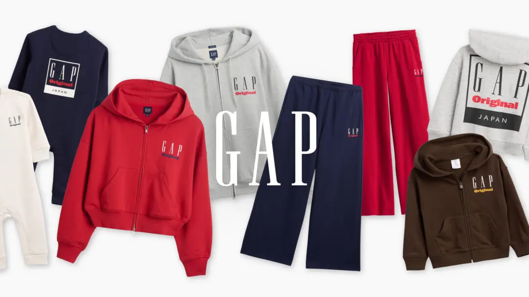A promotional collage showcasing Gap Original Japan apparel, featuring hoodies, sweatshirts, T-shirts, and wide-leg sweatpants in red, navy, grey, brown, and cream. The collection revives Gap's classic boxed logo with 'Original' branding, arranged against a clean white background with a large GAP wordmark centered across the composition.