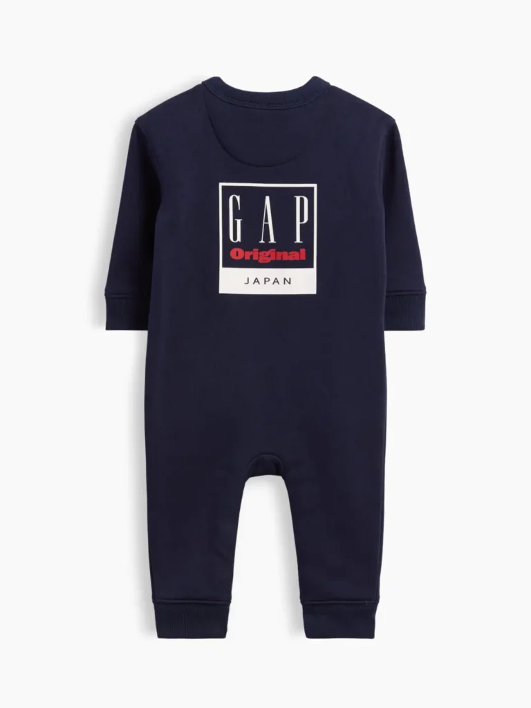 Navy baby long-sleeve romper featuring a large boxed GAP Original Japan graphic across the chest, ribbed cuffs, and snap closures at the inseam