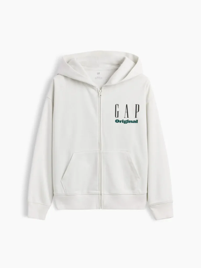 Cream GAP Original full-zip hoodie with a relaxed fit, drawstring hood, kangaroo pockets, ribbed hem and cuffs, and a black-and-green logo on the left chest