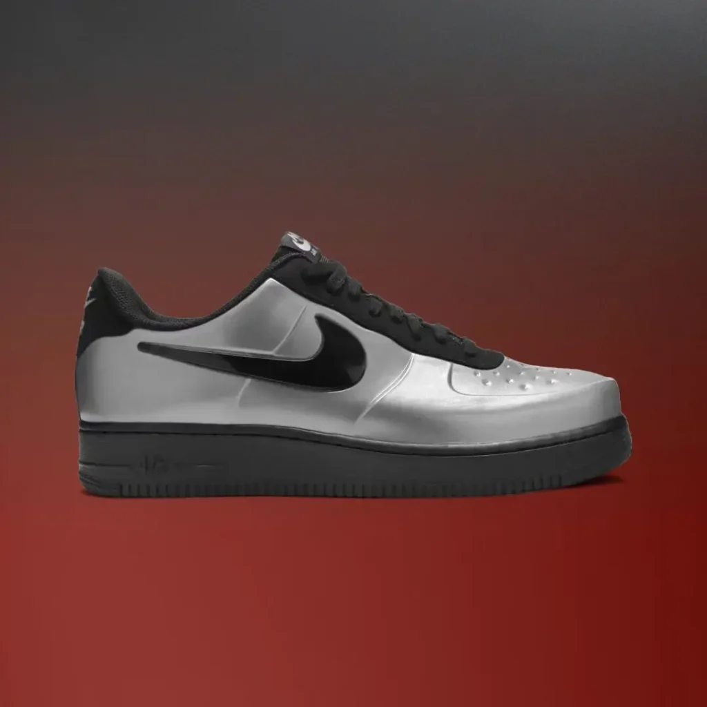 Side profile of a metallic silver Nike Air Force 1 Low featuring a black Swoosh, black laces, and a black rubber sole against a red gradient backdrop